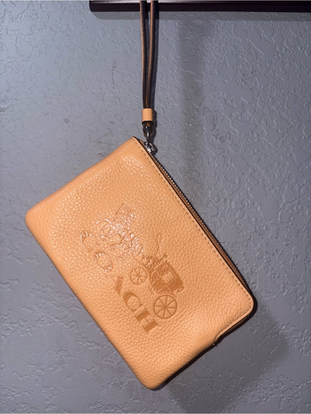COACH Pebbled Leather Wristlet in Peach-Tan